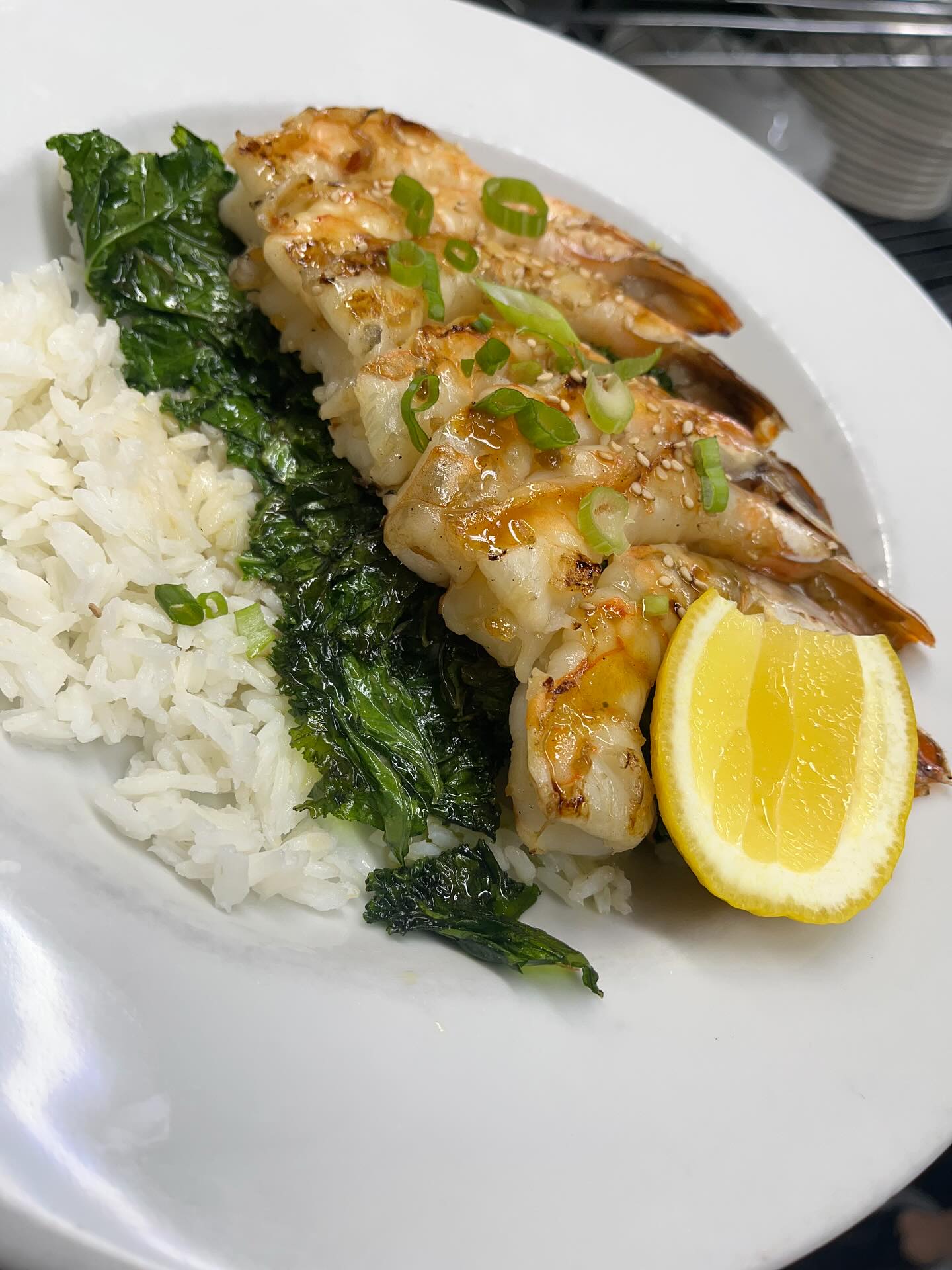 Grilled shrimp with rice and greens
